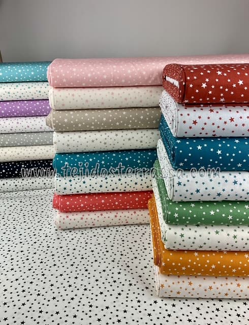 Algodón estampado “Estrellas desigual positivo/negativo”
